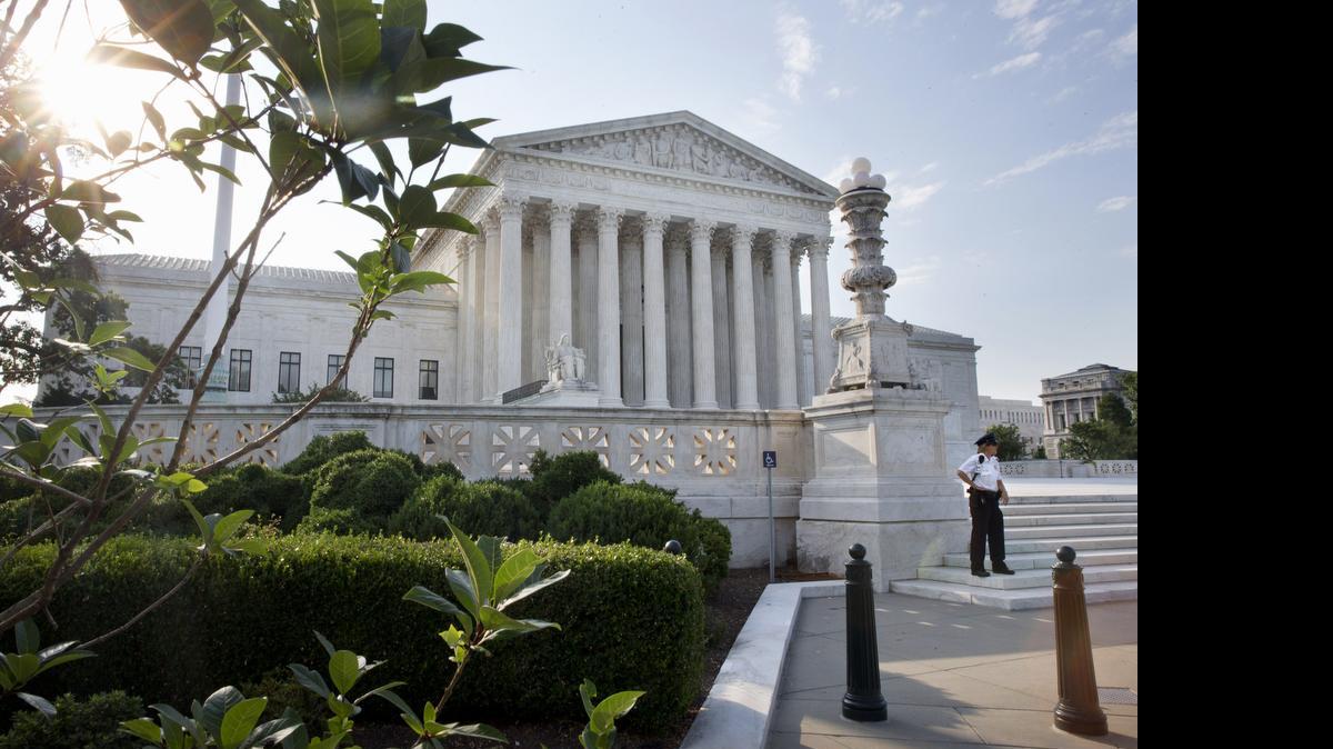
Security guards the Supreme Court in Washington, Thursday June 25, 2015. The court is expected to hand down decisions today. Two major opinions, health care and gay marriage, are among the remaining to be released before the term ends at the end of June. 
