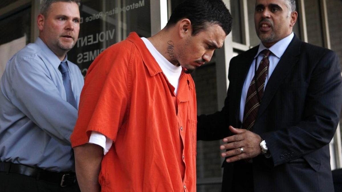 In this April 22, 2009 file photo, Ingmar Guandique is escorted from the Violent Crimes Unit in Washington. He is now awaiting retrial for the murder of Chandra Levy.