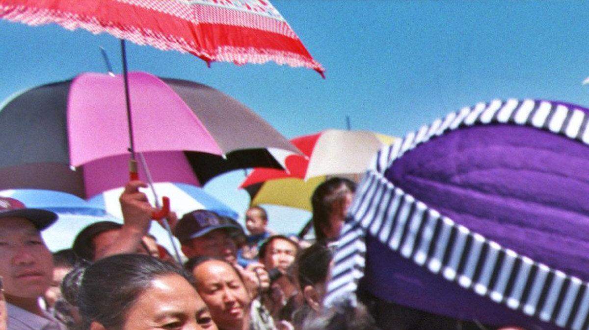 General Vang Pao is greeted by members of the Laotian and Hmong community during a 1999 event in Sacramento, Calif. The 2007 U.S. arrest of the late Hmong leader hurt him, but it did wonders for U.S.-Lao relations, classified State Department cables show.