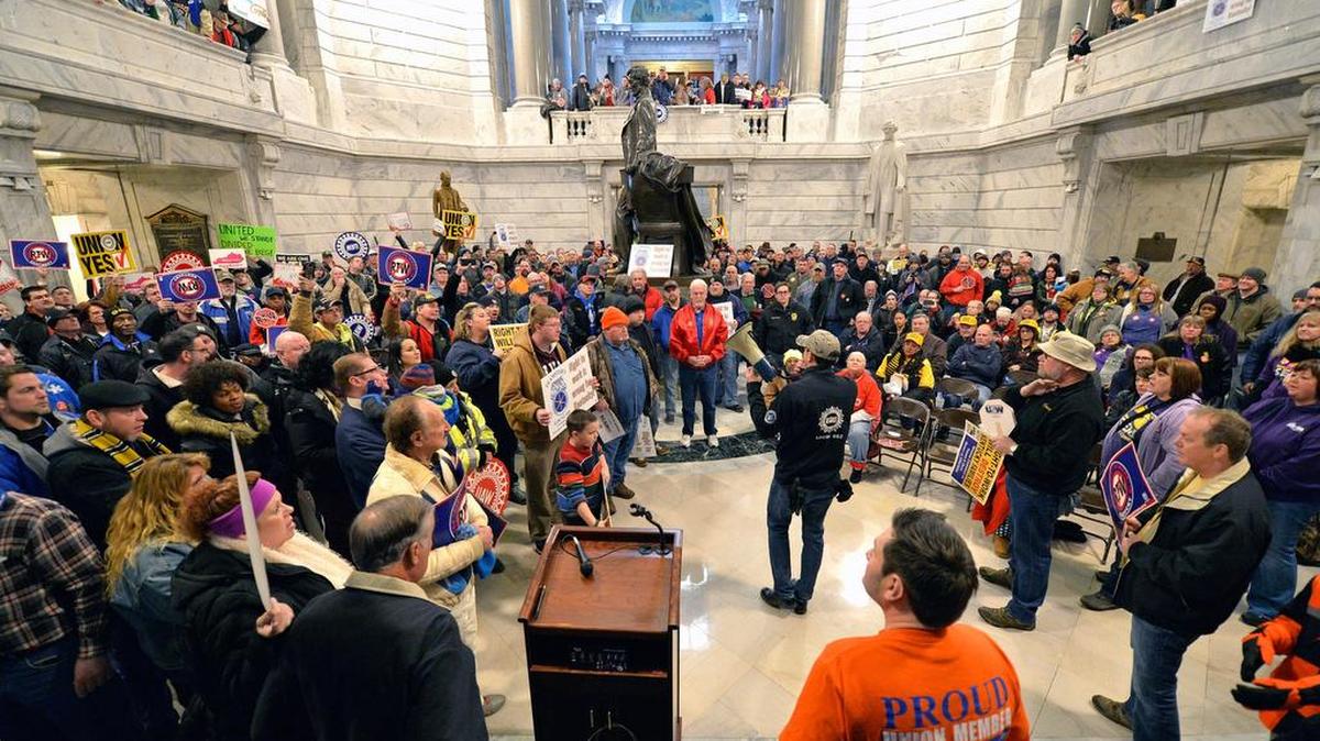 Union leaders speak to the protesters that fill the Kentucky Capitol rotunda in protest of Kentucky House Bill 1, Saturday, Jan. 7, 2017, in Frankfort, Ky. The bill, making it illegal for workers to have to join a labor union or pay dues to keep a job, was passed by the Senate, and now awaits the Governor's signature. (AP Photo/Timothy D. Easley)