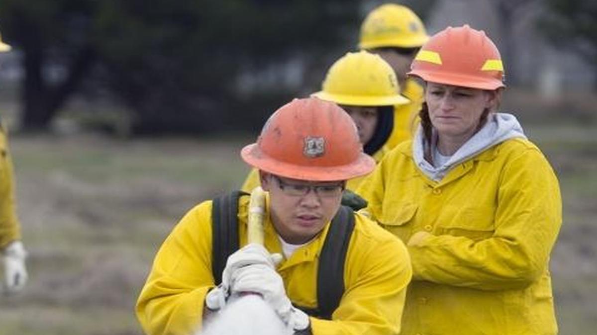 Tyron Demesa, a member of the Army National Guard, learns how to use a fire hose during a training exercise Jan. 14, 2016, in Sacramento, California. The U.S. Forest Service and Work for Warriors, an arm of the California National Guard, work together to train veterans and reservists.