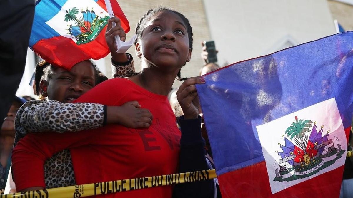 File photo from Jan. 15 at Mar-a-Lago resort, where President Trump vacations. Protesters gather after the president called Haiti, Africa and El Salvador places "shithole countries."