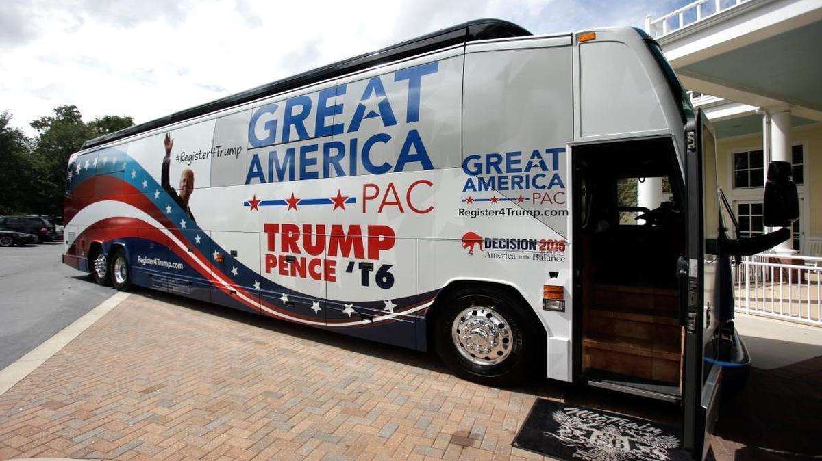 In this Monday, Sept. 12, 2016 photo, the Great America PAC bus makes a stop for a town hall meeting in Lake Mary, Fla. The Great America PAC is rolling through battleground states, opening offices and registering voters. Presidential hopefuls often embark on bus tours to meet voters across the country. This time, a super PAC is standing in for Republican nominee Donald Trump.