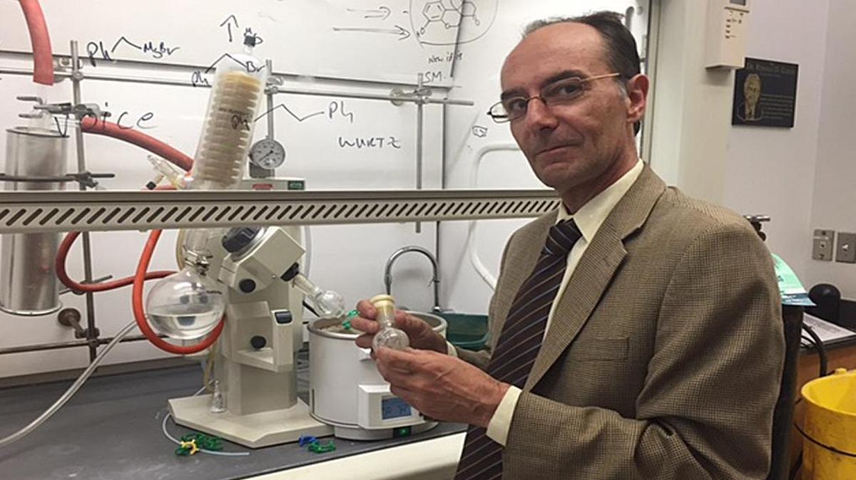 Andrew Coop, associate dean of academic affairs and professor at the University of Maryland School of Pharmacy, holds a small container of UMB425, a synthetic opioid painkiller he developed with Alex MacKerell, director of UM's Computer-Aided Drug Design Center. Unlike other prescription opioids, Coop says, the experimental drug will not cause physical dependency.