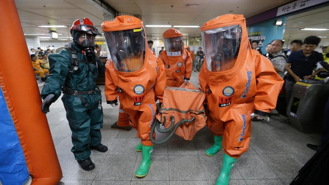 South Korean firefighters simulate a response to a potential chemical weapons attack while wearing protective gear at the Yoido Subway Station in Seoul on Aug. 23, 2016. First responders and U.S. and South Korean soldiers conduct such drills during the annual Ulchi Freedom Guardian exercise, the latest of which is scheduled to start next week in South Korea.
