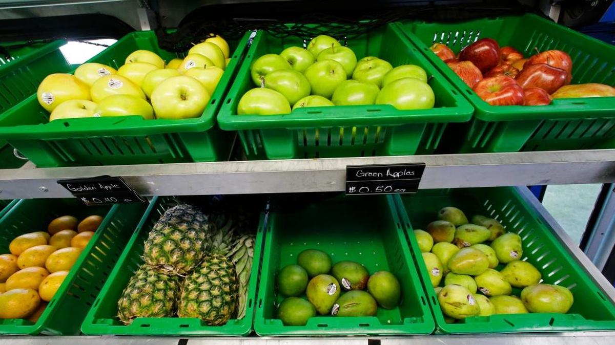 In this Wednesday, July 15, 2015, photo, a selection of fresh fruits available on the Fresh Stop bus, a mobile market, are seen in Eatonville, Florida. The Fresh Stop brings fresh fruits and vegetables to communities with no supermarkets. Many such communities are heavy users of the Supplemental Nutrition Assistance Program, the food stamp program known as SNAP.