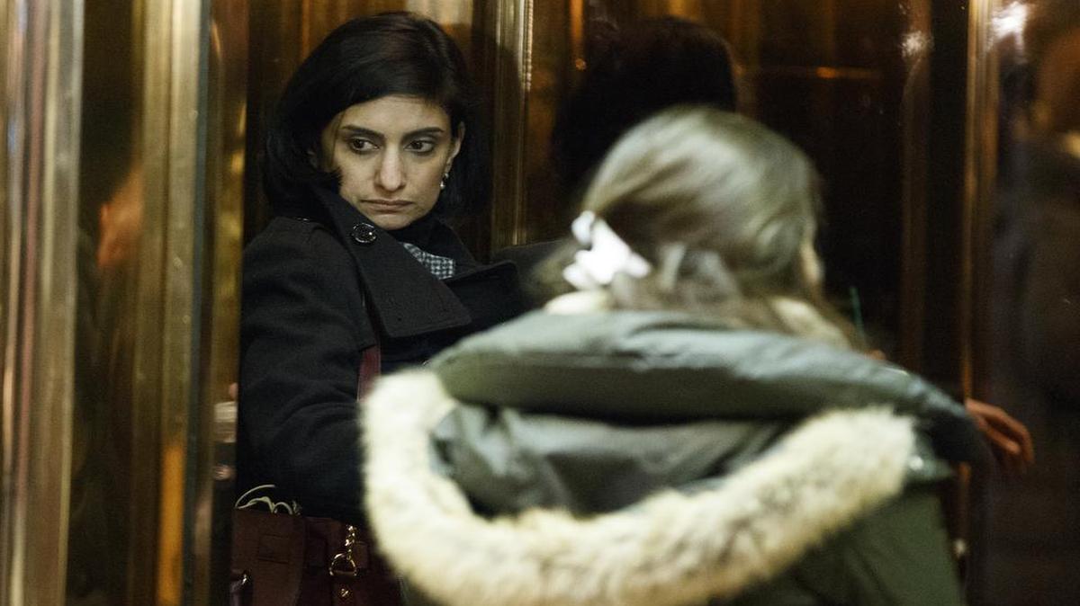 In this Jan. 10, 2017, file photo, Seema Verma, left, then President-elect Donald Trump's nominee for administrator of the Centers for Medicare & Medicaid Services, gets on an elevator in the lobby of Trump Tower in New York. Verma, the businesswoman selected by President Donald Trump to oversee Medicaid, the health care program for 74 million low-income Americans, has said the program is structurally flawed at its core by policies that burden states and foster dependency in the poor.