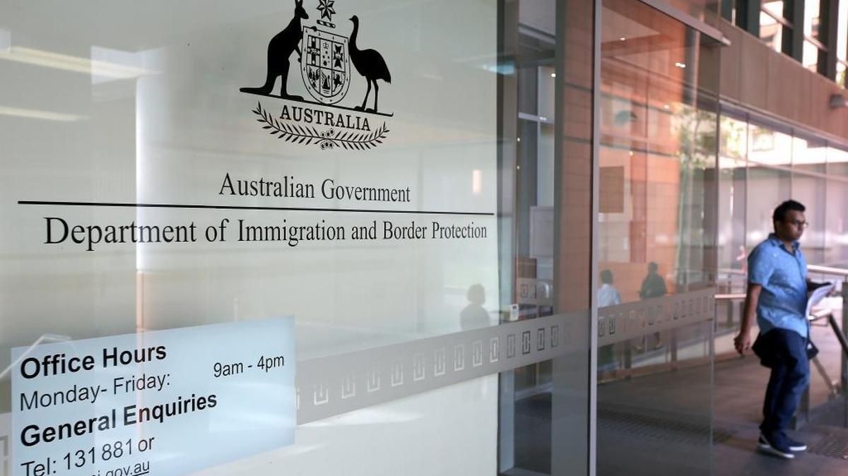 A man leaves the Department of Immigration and Border Protection offices in Sydney.