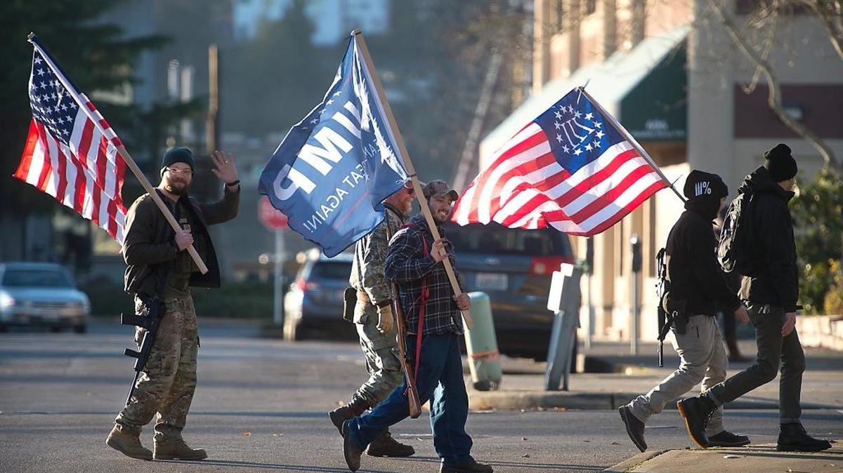 Members of the American Patriot III% Washington Chapter march through downtown Olympia to express their Second Amendment rights and support for President-elect Donald Trump on Friday, Dec. 16, 2016.