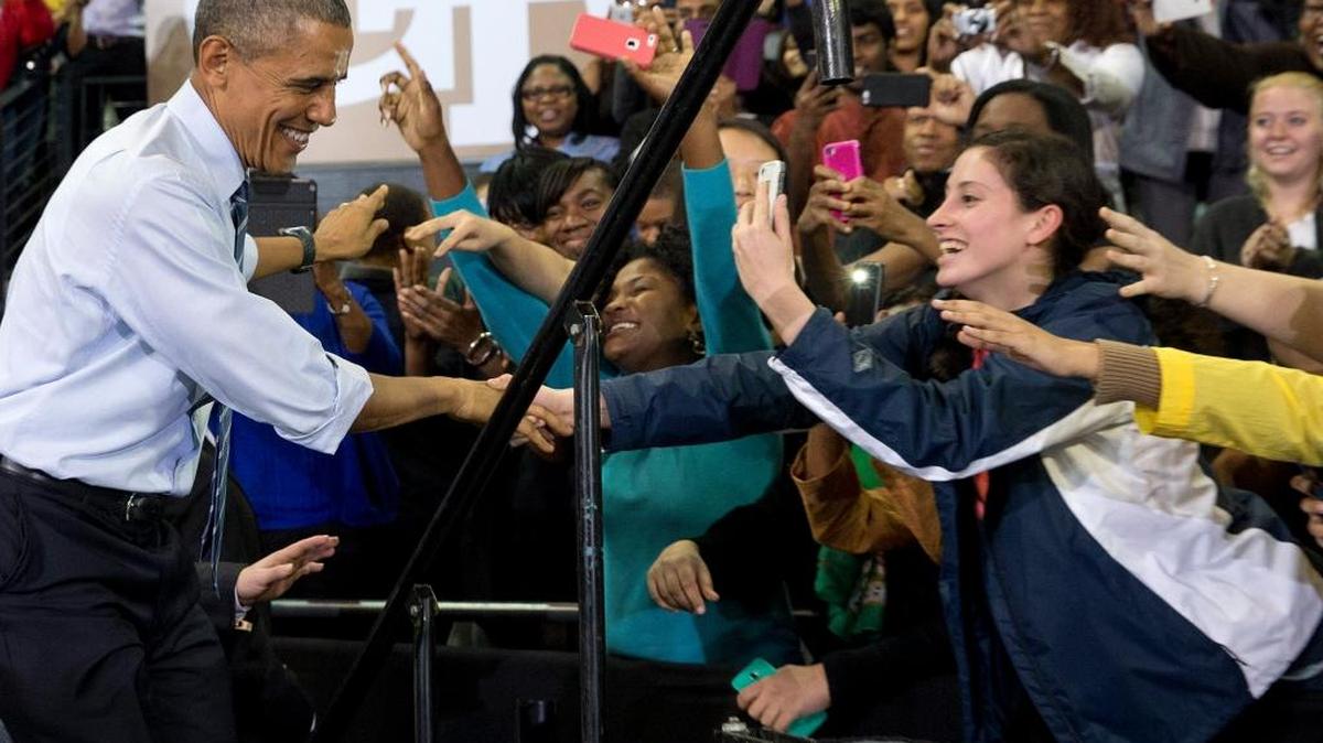 
In a file photo, Students reach out for President Barack Obama when he arrived to speak at Georgia Tech in Atlanta last March to talk about his plan to clamp down on the private companies that service federal student debt. More than 40 million Americans are in debt thanks to their education, and most of their loans come from Uncle Sam. 
