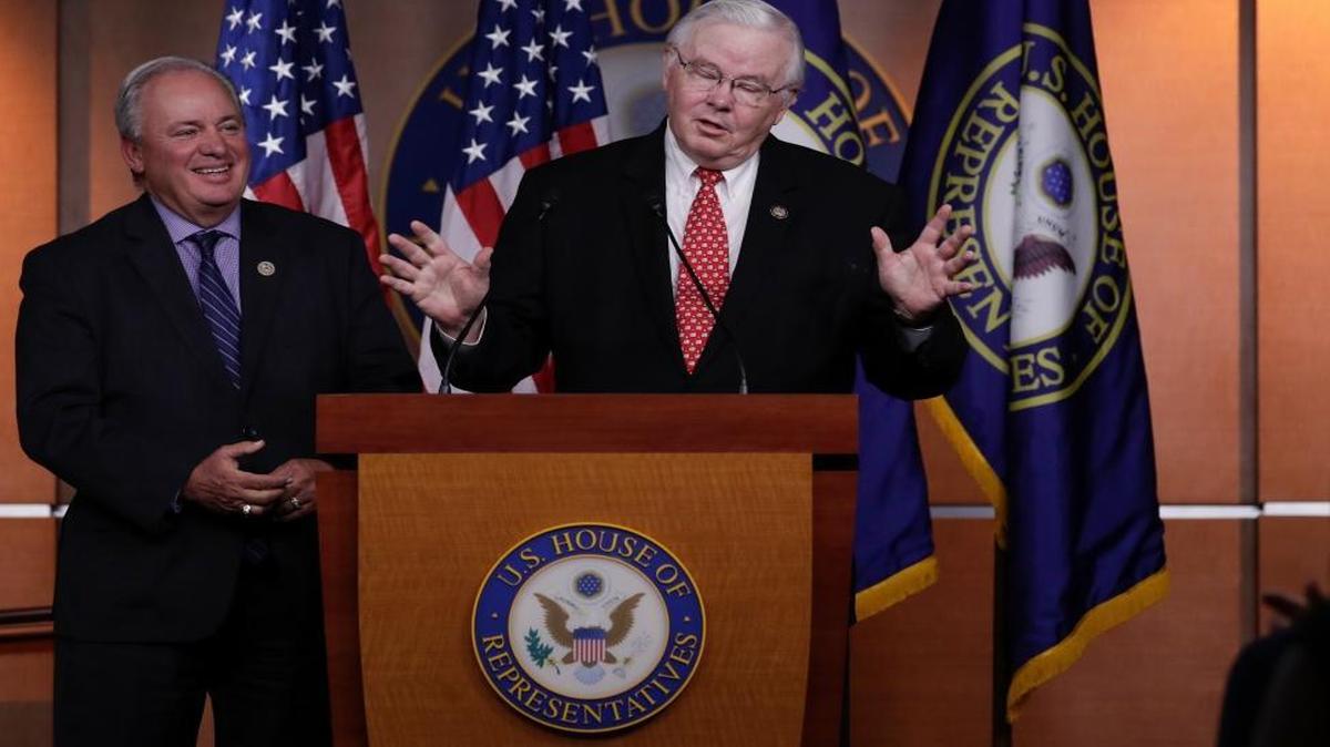 Rep. Mike Doyle, D-Pa., left and Rep. Joe Barton, R-Texas meet with reporters on Capitol Hill in Washington.