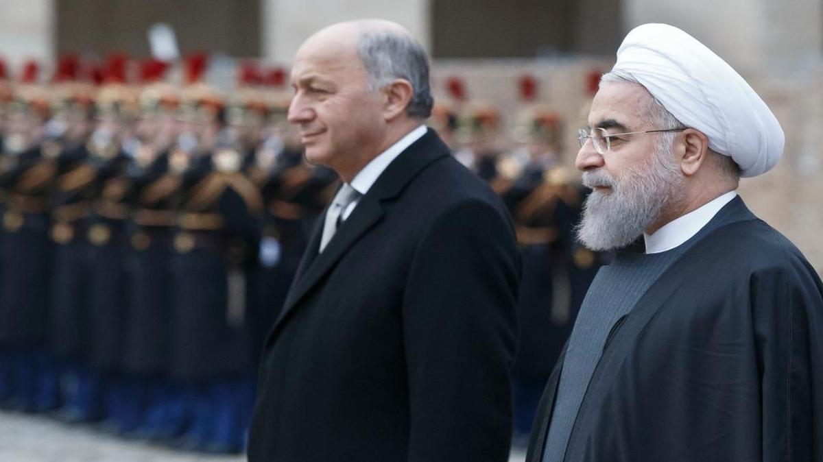 In their visa application to monitor Iran’s upcoming elections, Rep. Mike Pompeo, R-Kan., and two other GOP lawmakers requested a meeting with Iranian President Hassan Rouhani, seen here, right, last month in Paris.