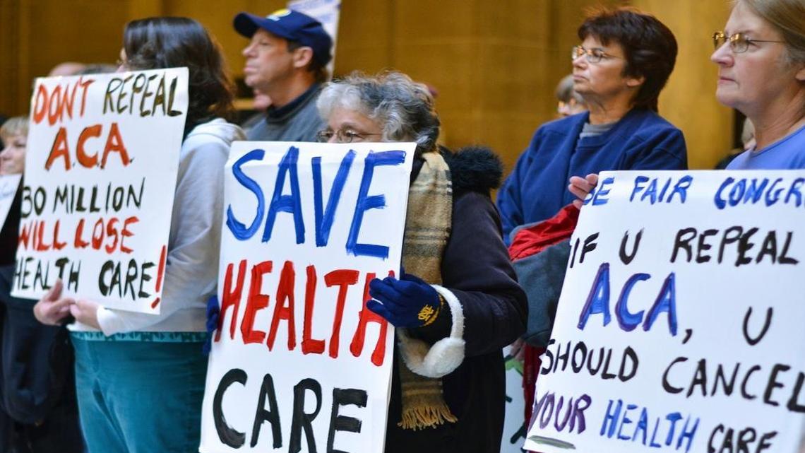 People attend a health care rally at the Indiana Statehouse in support of the Affordable Care Act, Jan. 15, 2017, in Indianapolis. President-elect Donald Trump has vowed to overturn and replace the Affordable Care Act, and majority Republicans in Congress have begun the process of repealing it.