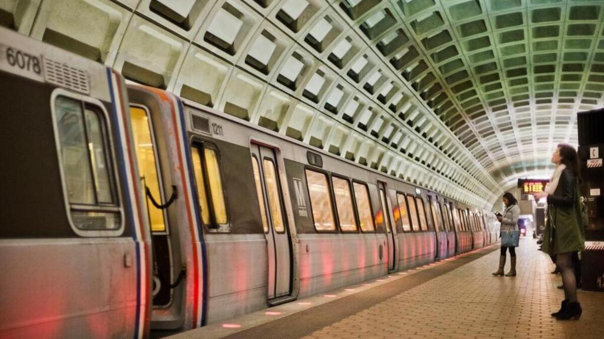 Passengers wait on the platform before boarding a Metro train in Washington, D.C.