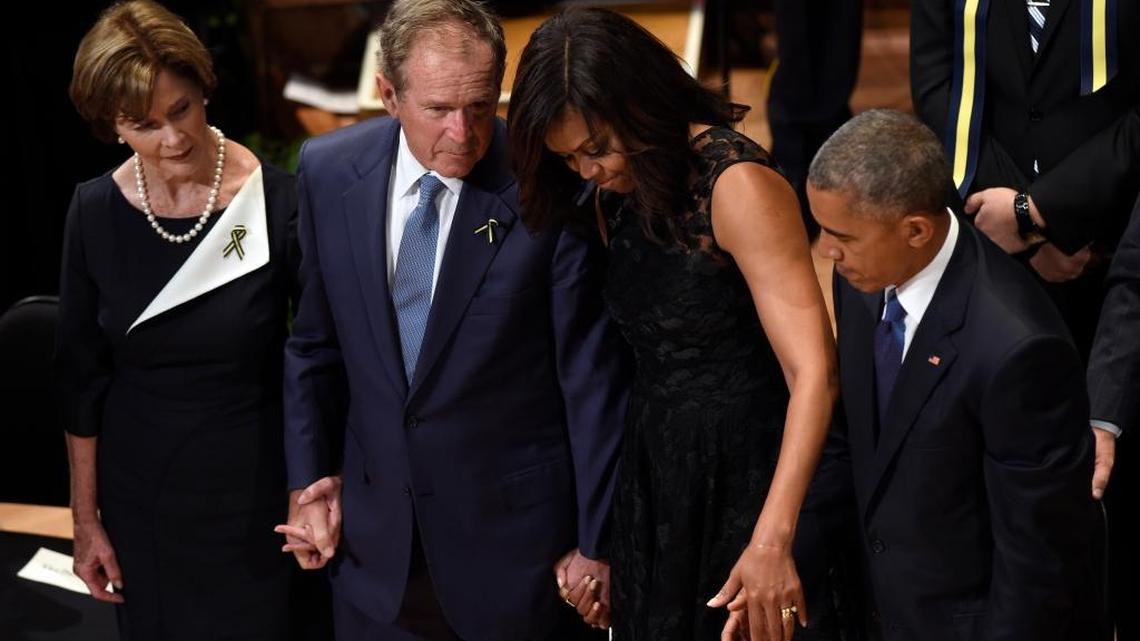 Former first lady Laura Bush, left, former President George W. Bush, first lady Michelle Obama and President Barack Obama attended the interfaith memorial service for the fallen police officers and members of the Dallas community in Dallas, Tuesday, July 12, 2016.