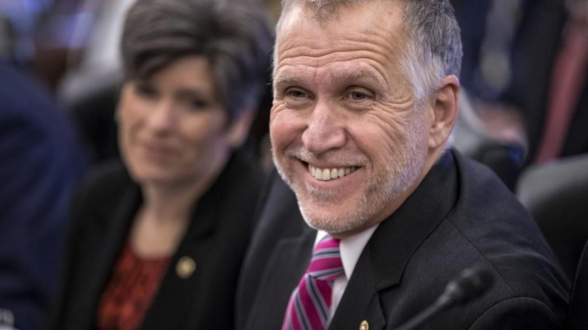 Senate Agriculture Committee members Sen. Thom Tillis, R-N.C., with Sen. Joni Ernst, R-Iowa, left, joins other members of the committee on Capitol Hill in Washington, Wednesday, Jan. 20, 2016, as the panel approved new measures to set fat, sugar and sodium limits in school lunches.