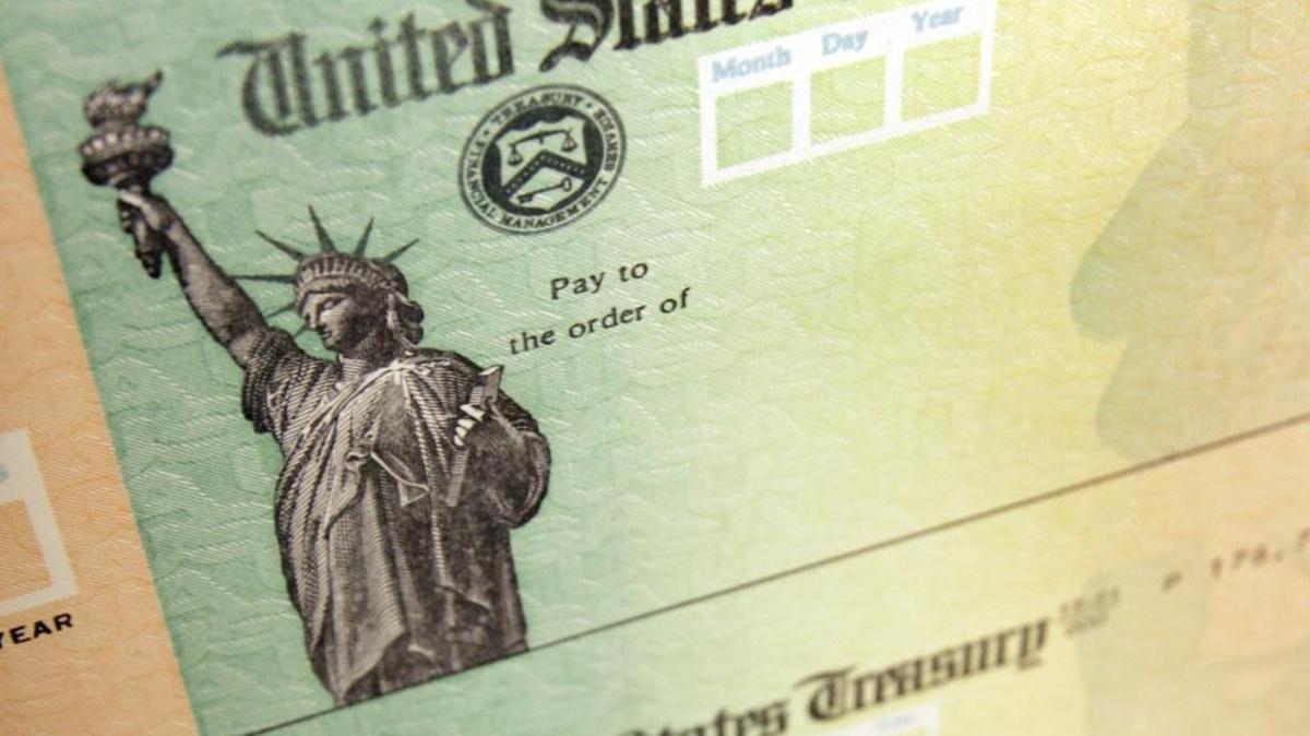 In this May 8, 2008, photo, blank U.S. Treasury checks are seen on an idle press at the Philadelphia Regional Financial Center. The Obama administration wants people to invest their income tax refunds into new myRA accounts.