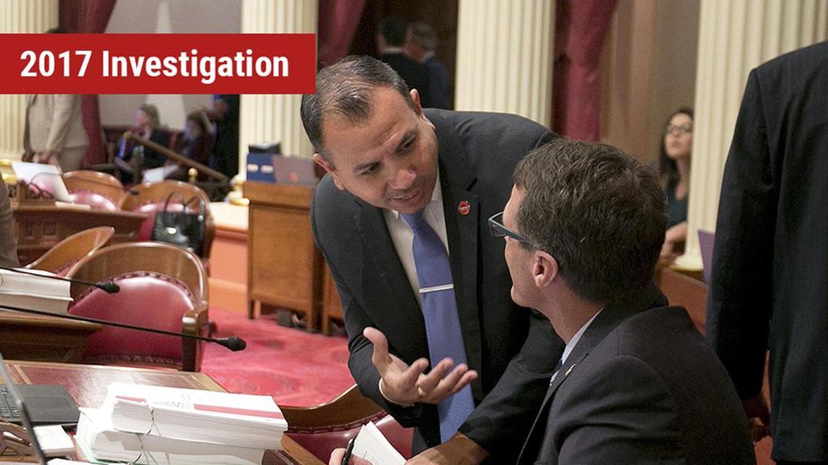 State Sen. Tony Mendoza, D-Artesia, left, talks with Sen. Ted Gaines, R-El Dorado Hills, during the Senate session on May 30, 2017.