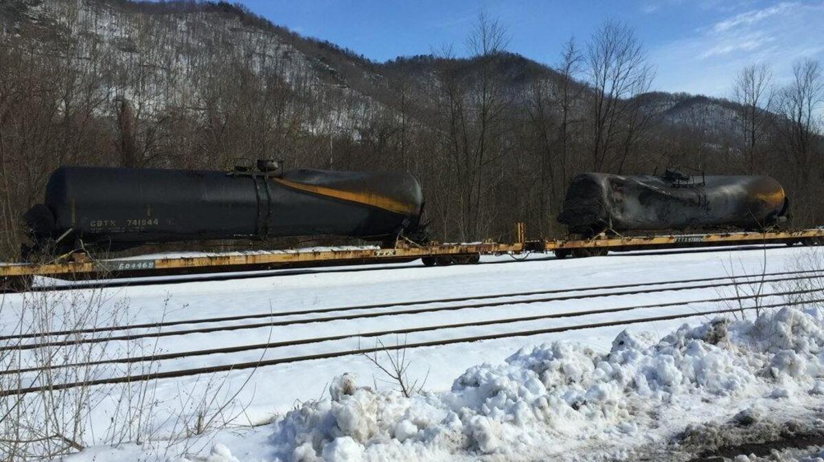 
Scorched and deformed tank cars await examination by federal investigators at Handley, W.Va., on Feb. 24, 2015. A CSX train carrying crude oil had derailed a week earlier, spilling nearly 400,000 gallons and igniting a fire that kept 100 people from their homes for four days.
