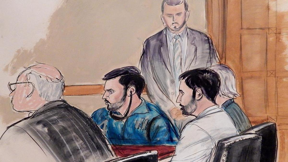 In this courtroom sketch, a U.S. marshall stands guard as Francisco Flores, center in blue shirt, and Efrain Campos, second from right, make an initial appearance in Manhattan federal court on Thursday, Nov. 12, 2015, in New York. Campos and Flores, nephews of Venezuela's first lady, are accused of conspiring to smuggle cocaine into the United States. (AP Photo/Elizabeth Williams)