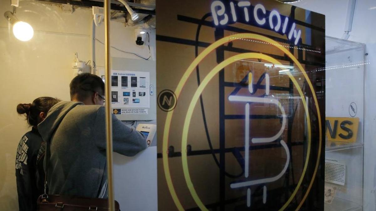 Here, people use a Bitcoin ATM in Hong Kong. The U.S. Marshals Service will be auctioning off bitcoins seized in criminal and civil asset forfeitures, though it’s unclear whether bargains will be had.