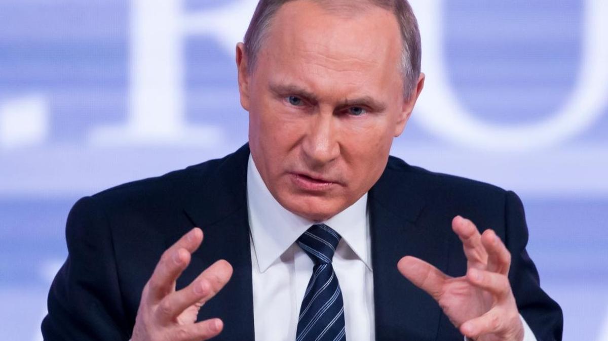Russian President Vladimir Putin gestures during his annual end of year news conference in Moscow, Russia, Thursday, Dec. 17, 2015. President Vladimir Putin said Thursday Russia is ready to improve ties with the United States and work with whomever is elected its next president.