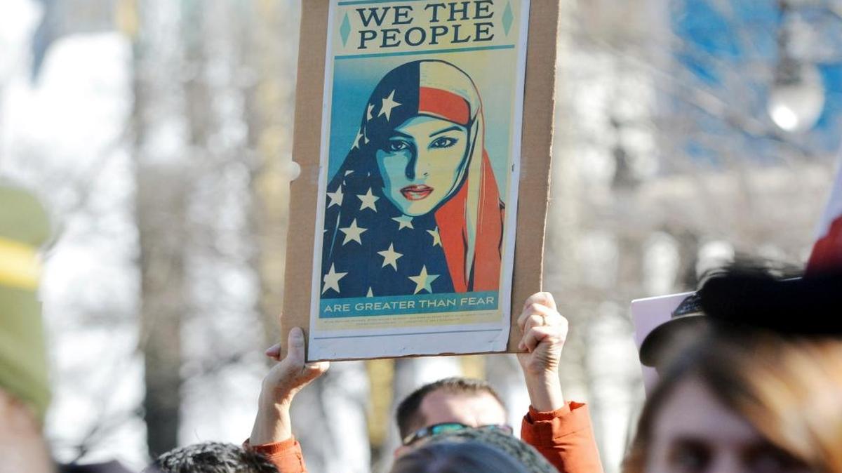 Hundreds of people gathered in downtown Durham to show their support for refugees and immigrants and stand against President Donald Trump's plan to ban refugees of Muslim countries, Friday, Jan. 27, 2017. in Durham, N.C.
