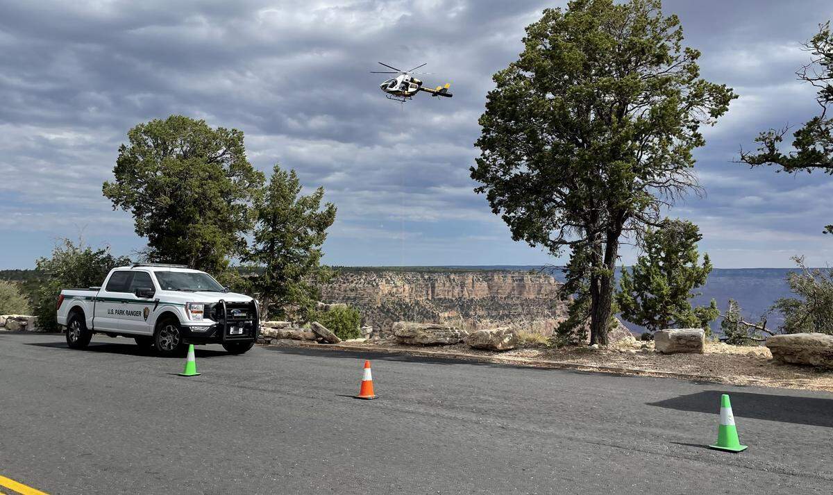 This photo shows rangers at the viewpoint where her body was found.