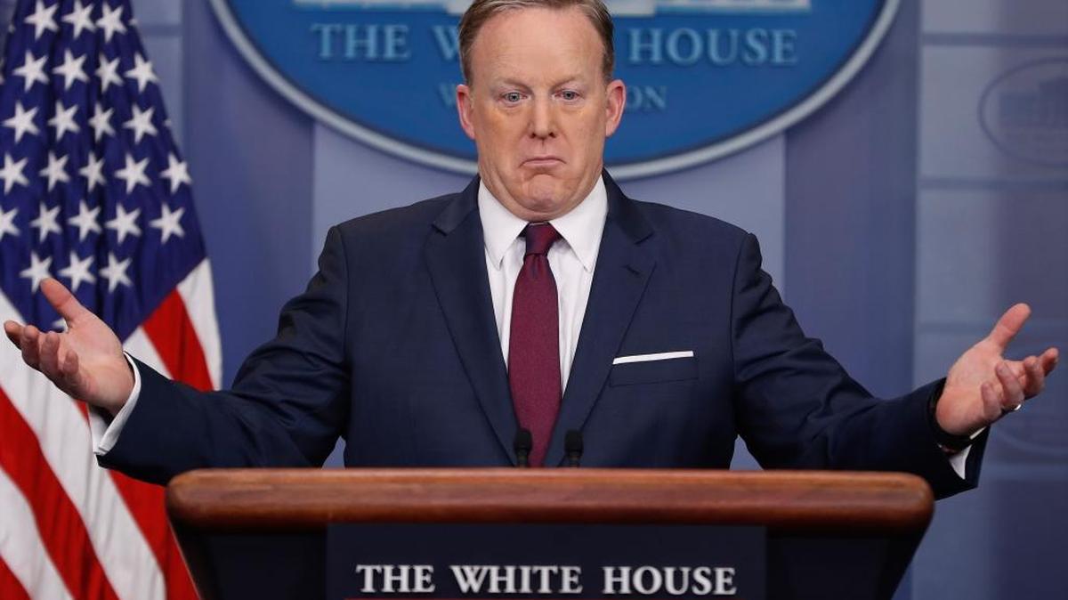White House press secretary Sean Spicer gestures while speaking to the media during the daily briefing in the Brady Press Briefing Room of the White House in Washington, Friday, March 24, 2017.