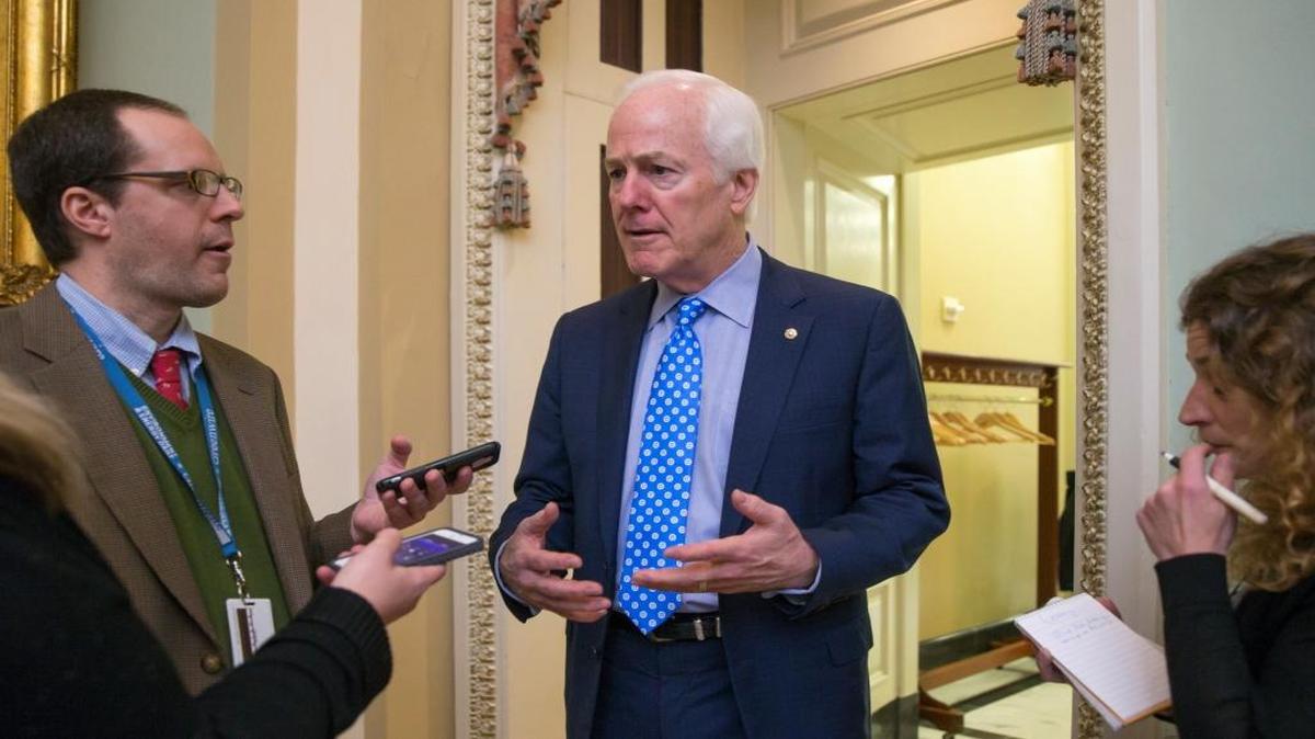 Senate Majority Whip John Cornyn of Texas, talks to reporters on Capitol Hill in Washington, Wednesday, Feb. 3, 2016, as he walks to a closed-door meeting with fellow Republicans during work on the energy reform bill.
