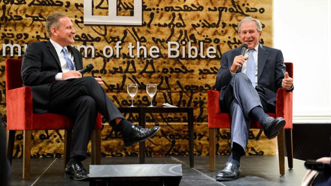 Former President George W. Bush (right) spoke with an audience of civic and business leaders at a Nov. 2, 2014, Museum of the Bible event in Dallas about the role of the Bible in his personal life and his own experience in building a presidential library and museum. Museum of the Bible Board Chairman Steve Green appears at left.