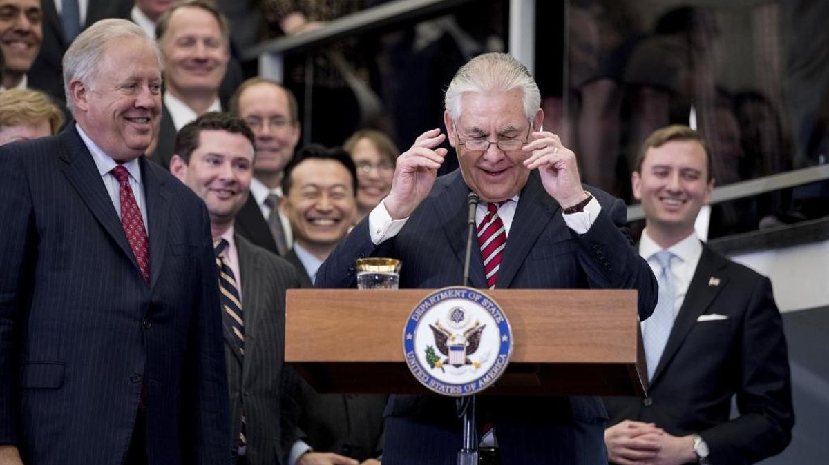 Secretary of State Rex Tillerson, accompanied by State Department Undersecretary for Political Affairs Tom Shannon, left, takes the podium to speak to State Department employees on Feb. 2, 2017.