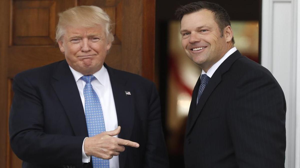 President-elect Donald Trump greets Kansas Secretary of State, Kris Kobach, as he arrive at the Trump National Golf Club Bedminster clubhouse, Sunday, Nov. 20, 2016, in Bedminster, N.J.