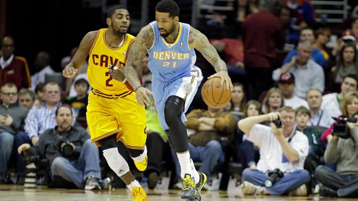 Cleveland Cavaliers guard Kyrie Irving, left, said in a podcast Friday that he believes the Earth is flat. Denver Nuggets forward Wilson Chandler, right, said on Twitter that he agrees with Irving.