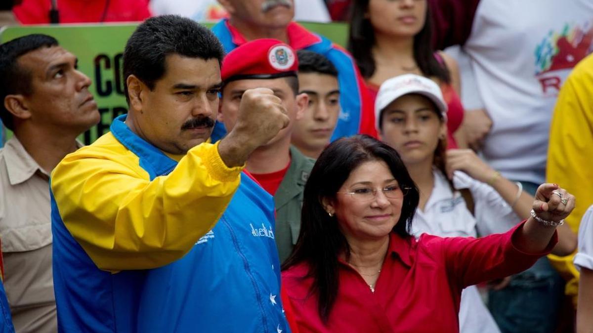 Venezuela's President Nicolas Maduro and first lady Cilia Flores at a march in Caracas, Venezuela. Two Flores nephews are accused of conspiring to smuggle 800 kilograms of cocaine into the U.S.