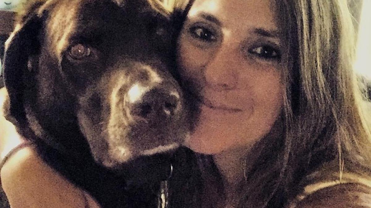 Lisa McCombs, honorably discharged from the Army in 2009 as a captain, acquired her service dog, Jake, after being diagnosed with PTSD from her time serving in Iraq and Afghanistan.