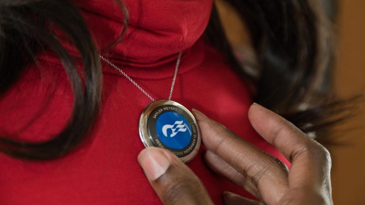For an additional charge, guests can purchase a pendant, wrist band, clip or keychain to wear their medallion. The medallion itself is provided to each traveler free of charge.