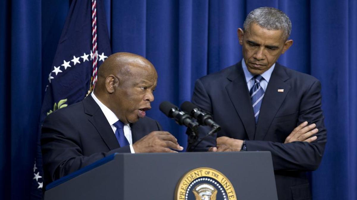 
President Barack Obama stands by Rep. John Lewis, D-Ga., as he speaks in the South Court Auditorium in the Eisenhower Executive Office Building on the White House complex, Thursday, Aug. 6, 2015, in Washington, about the 50th anniversary of the Voting Rights Act.
