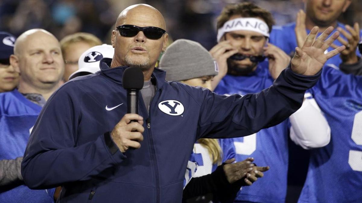 In this Oct. 3, 2014, photo, former Chicago Bears quarterback Jim McMahon speaks as his No. 9 jersey went on permanent display at LaVell Edwards Stadium, during BYU's NCAA college football game against Utah State in Provo, Utah. McMahon calls himself "old school," including his use of marijuana both during and after his career. He will be featured in a 30-second ad touting medical marijuana on Thursday Night Football
