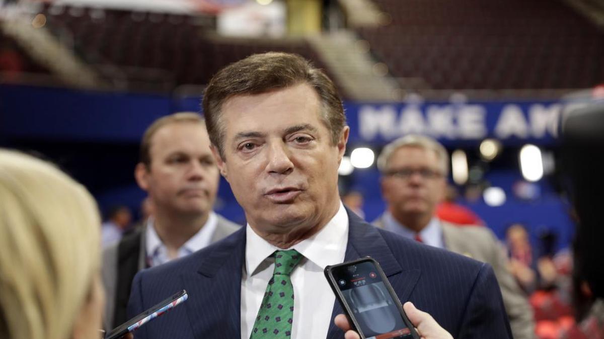 Trump Campaign Chairman Paul Manafort talks to reporters on the floor of the Republican National Convention at Quicken Loans Arena, Sunday, July 17, 2016, in Cleveland.