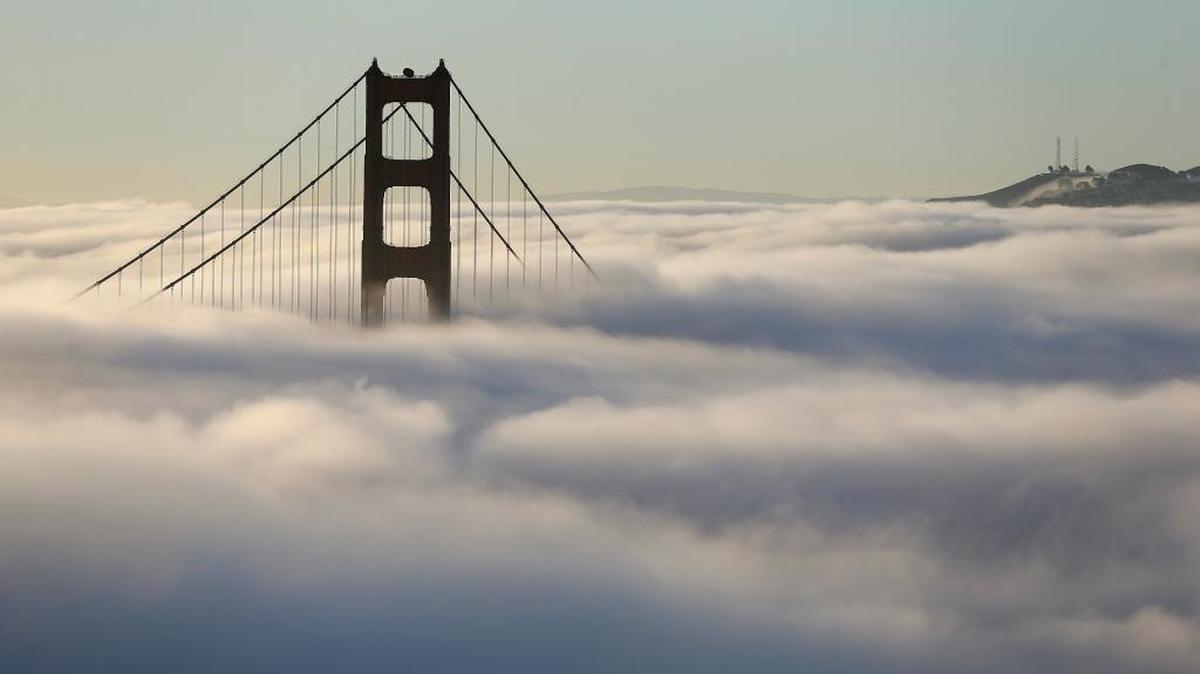 Fog blankets the south tower of the Golden Gate Bridge in San Francisco on Friday, Oct. 21, 2016. Some scientists want to pursue research into whether marine clouds could be seeded with salt water or other particles, to counter impacts of climate change. Known as “marine cloud brightening,” this technique aims to increase the ability of clouds to reflect solar energy away from the Earth’s surface, reducing temperatures caused by global warming.