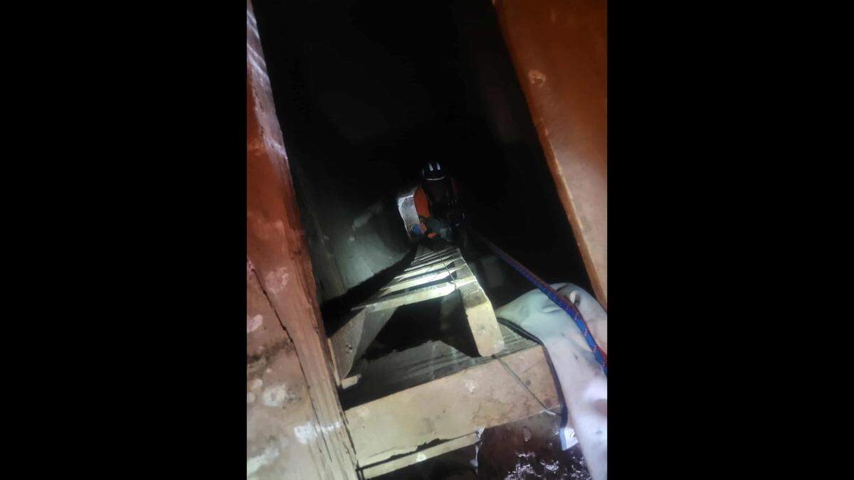 A rescuer was lowered into the mine shaft.