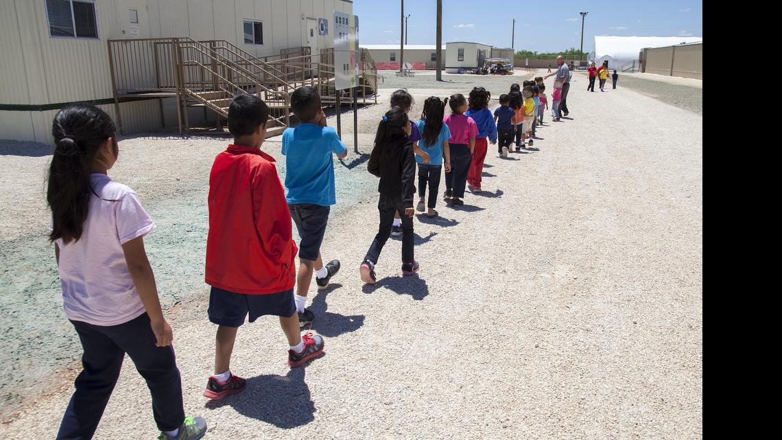 
Children walk to class at the South Texas Family Residential Center in Dilley, Texas.
