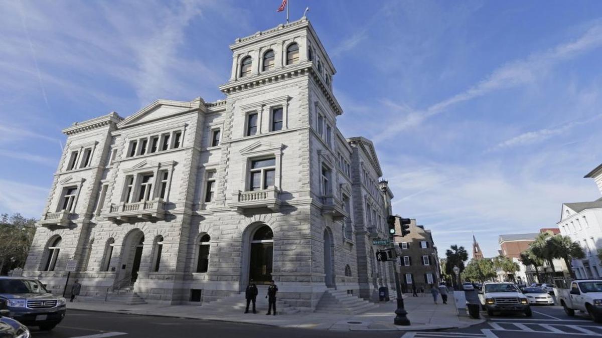Federal agents patrol outside the federal courthouse in downtown Charleston last week.