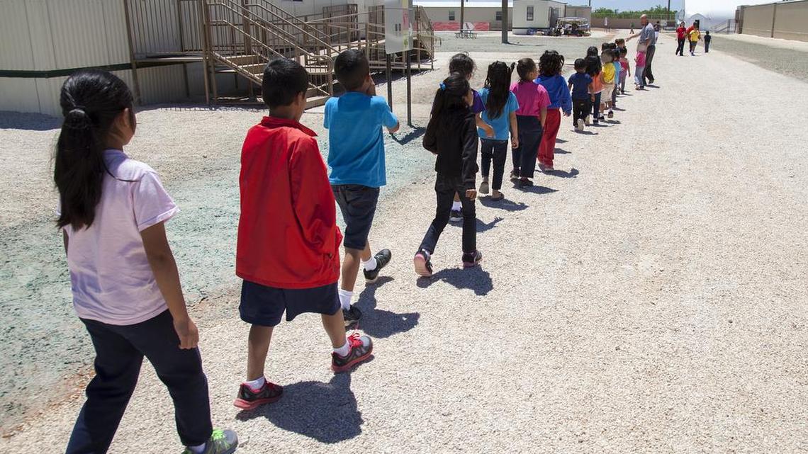 
Children walk to class at the South Texas Family Residential Center in Dilley, Texas.
