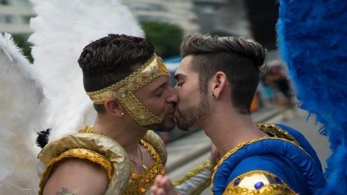 Two men kiss during the Gay Pride Parade at Copacabana beach, in Rio de Janeiro, Brazil, in November 2015.