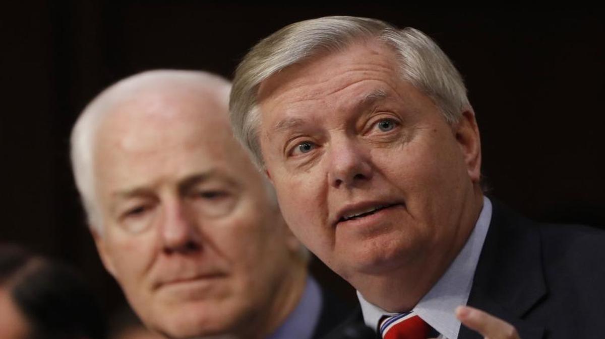 Senate Judiciary Committee member Sen. Lindsey Graham, R-S.C., right, accompanied by Sen. John Cornyn, R-Texas, speaks on Capitol Hill in Washington, Monday, March 20, 2017, during the committee's confirmation hearing for Supreme Court Justice nominee Neil Gorsuch.