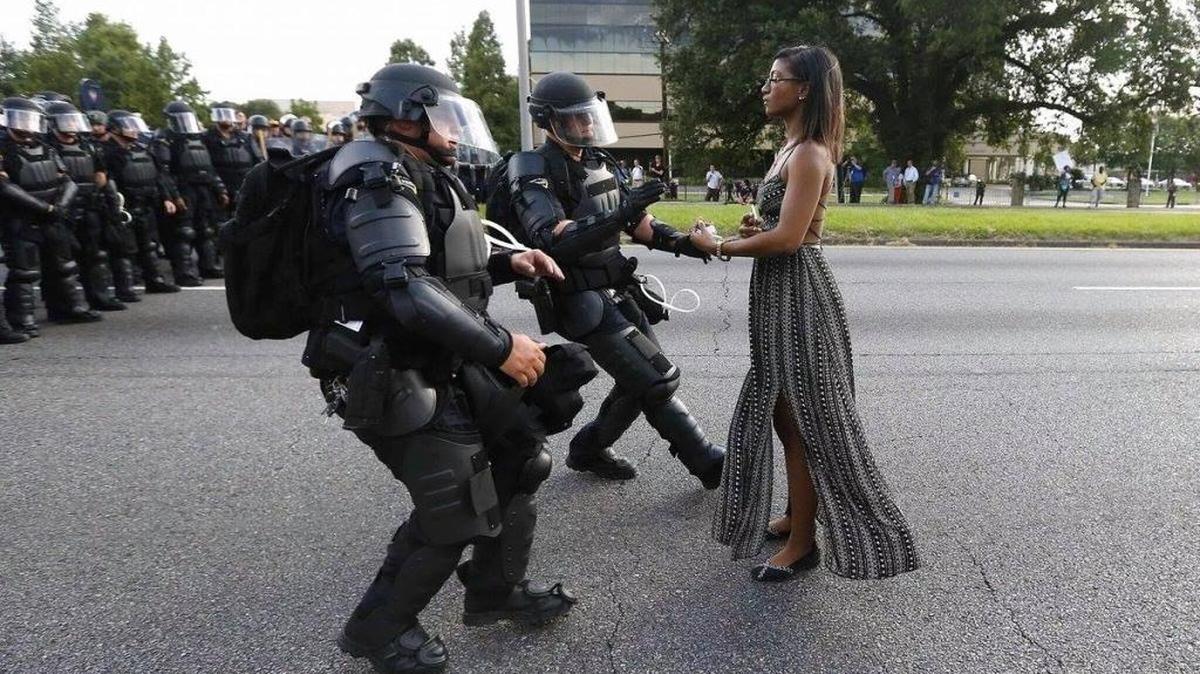 A demonstrator protesting the shooting death of Alton Sterling is detained by law enforcement in Baton Rouge on July 9, 2016.