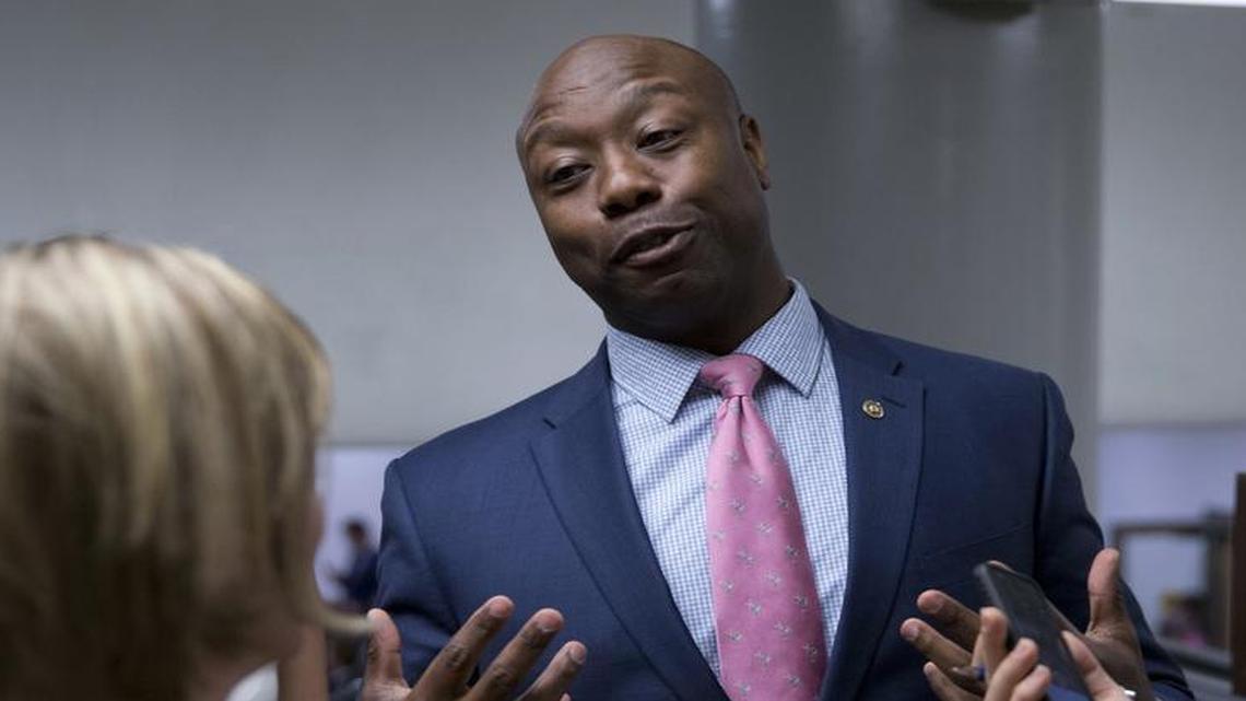 In this June 21, 2016, file photo, Sen. Tim Scott, R-S.C., talks with reporters on Capitol Hill in Washington.