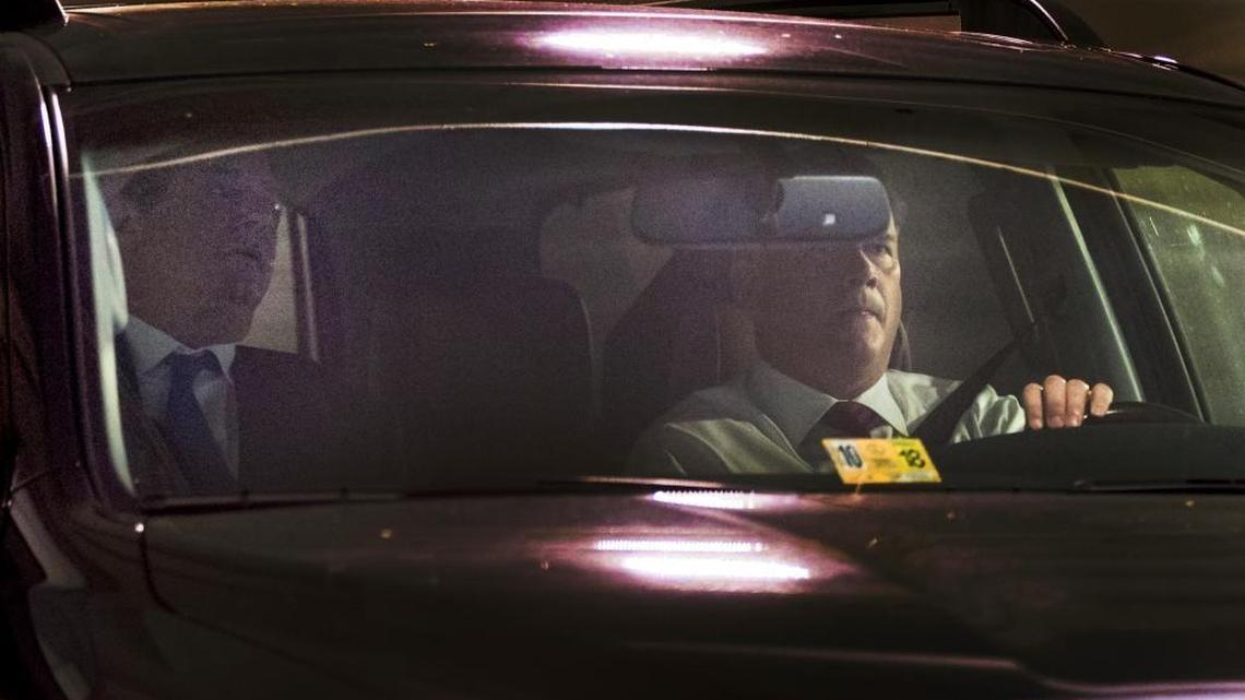Former Trump Campaign Chairman Paul Manafort, left, leaves his home in Alexandria, Va., Monday, Oct. 30, 2017.
